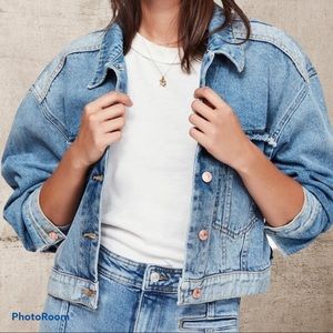 NWOT Free people cropped denim jacket. Buckle detail in back.